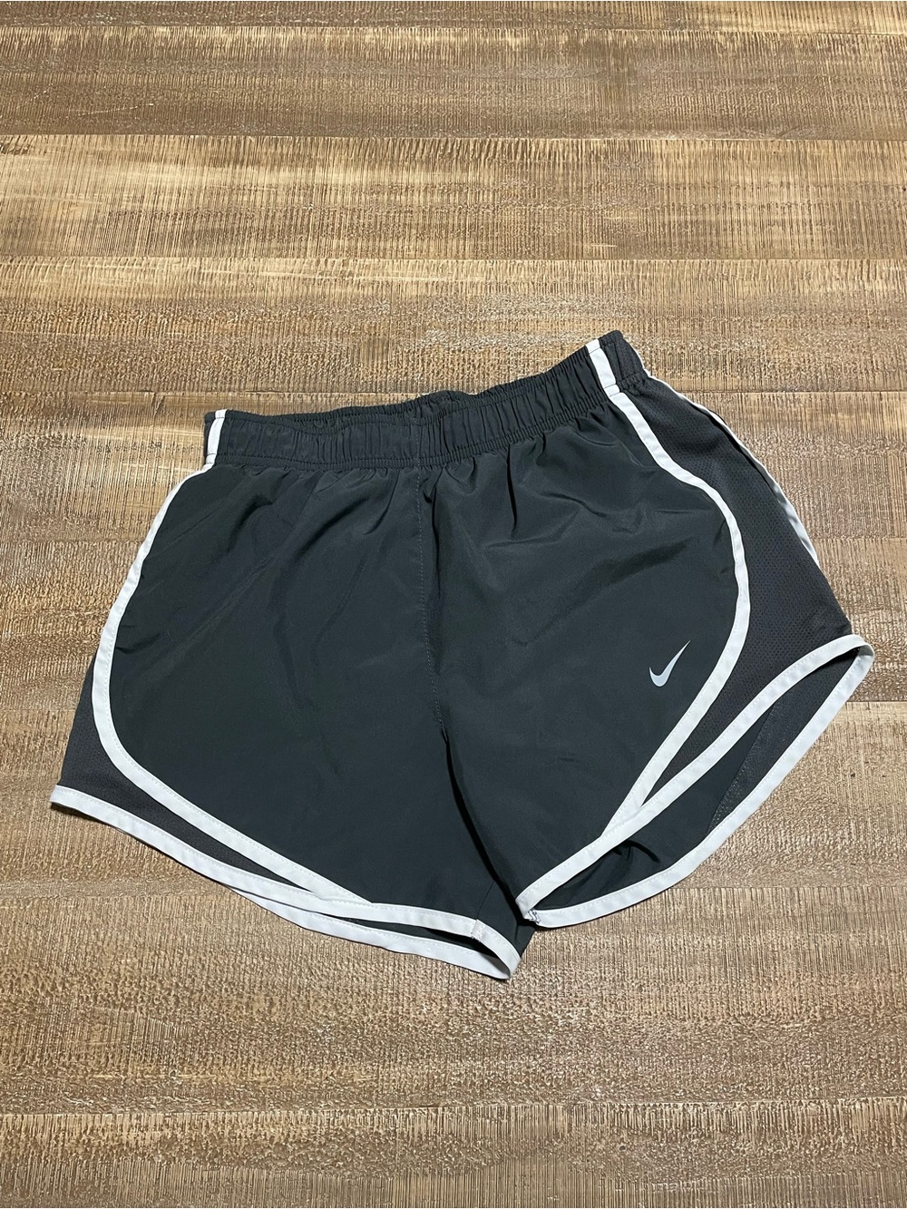 Nike Women’s dark gray Shorts with White Piping